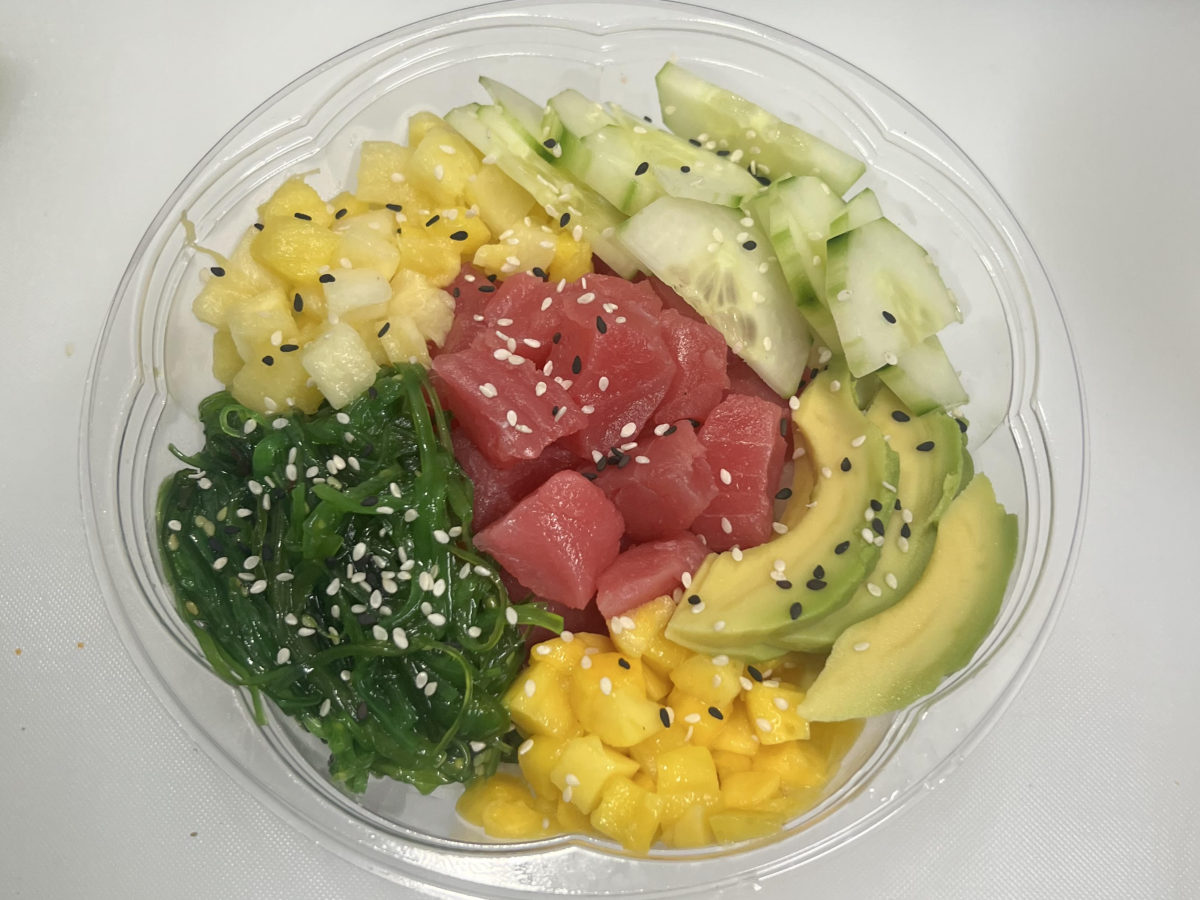 Poke bowl with tuna, avocado, cucumber, pineapple and seaweed salad